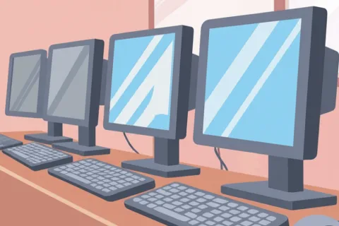 Computers lined up with monitors and keyboards